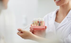 Prosthesis on implants in Tenerife shown on a dental model during clinical assessment